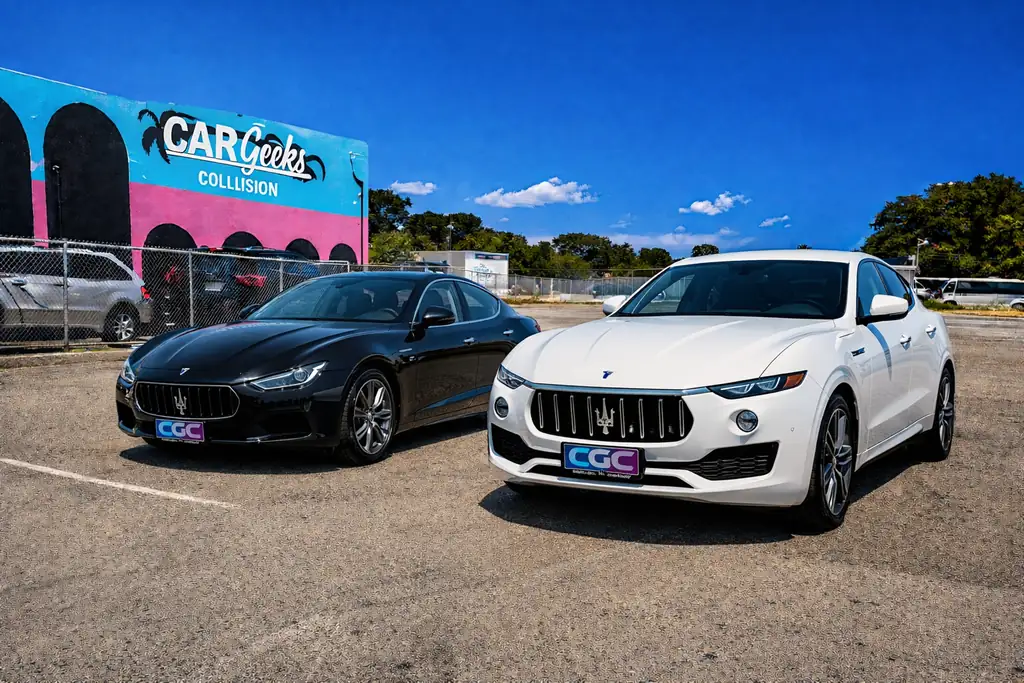 Two Maserati vehicles in front of the Car Geeks Collision shop