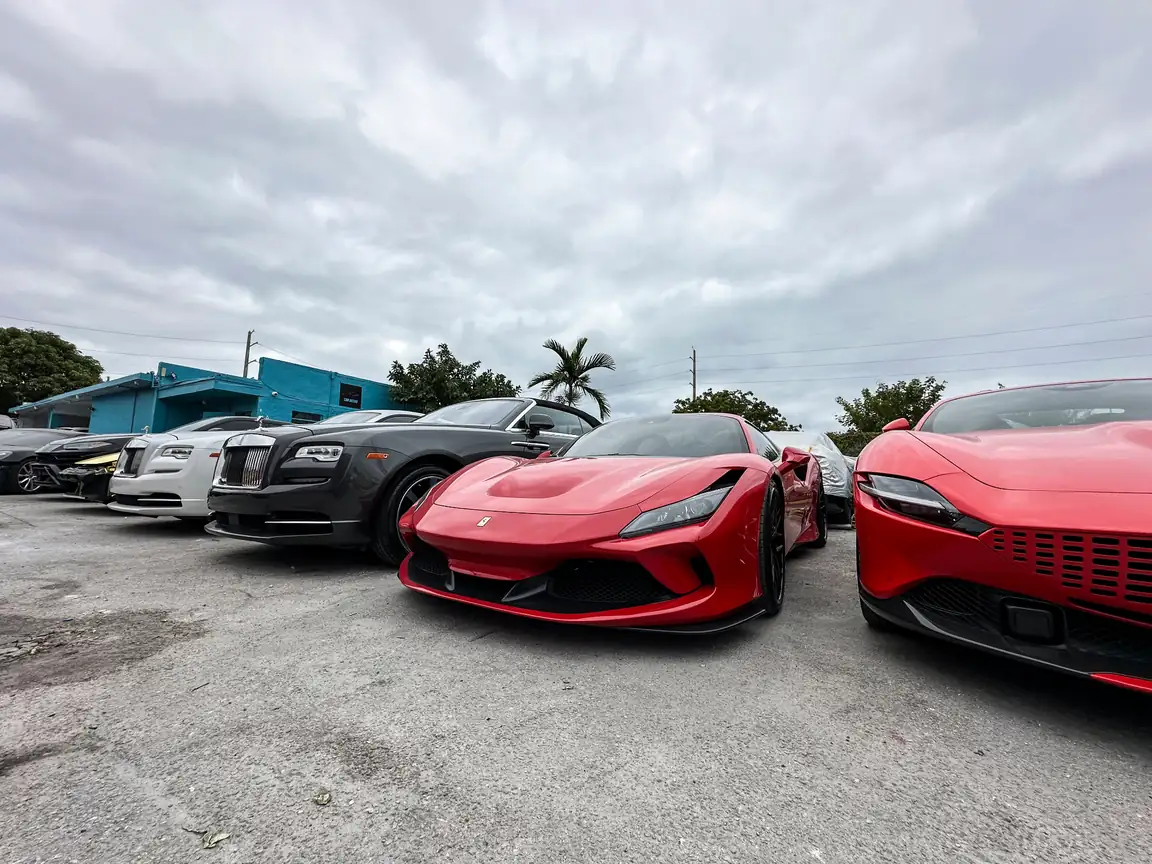 Ferrari, Rolls-Royce, and luxury vehicles at Car Geeks Collision body shop